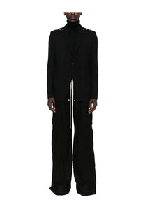 Black tailored blazer with silver studs on shoulders and central zipper detail paired with Rick Owens men’s cargo pants bela black