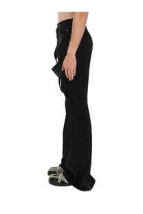 Rick Owens men’s black wide-leg pants with distinctive asymmetrical draped fabric panel on the side