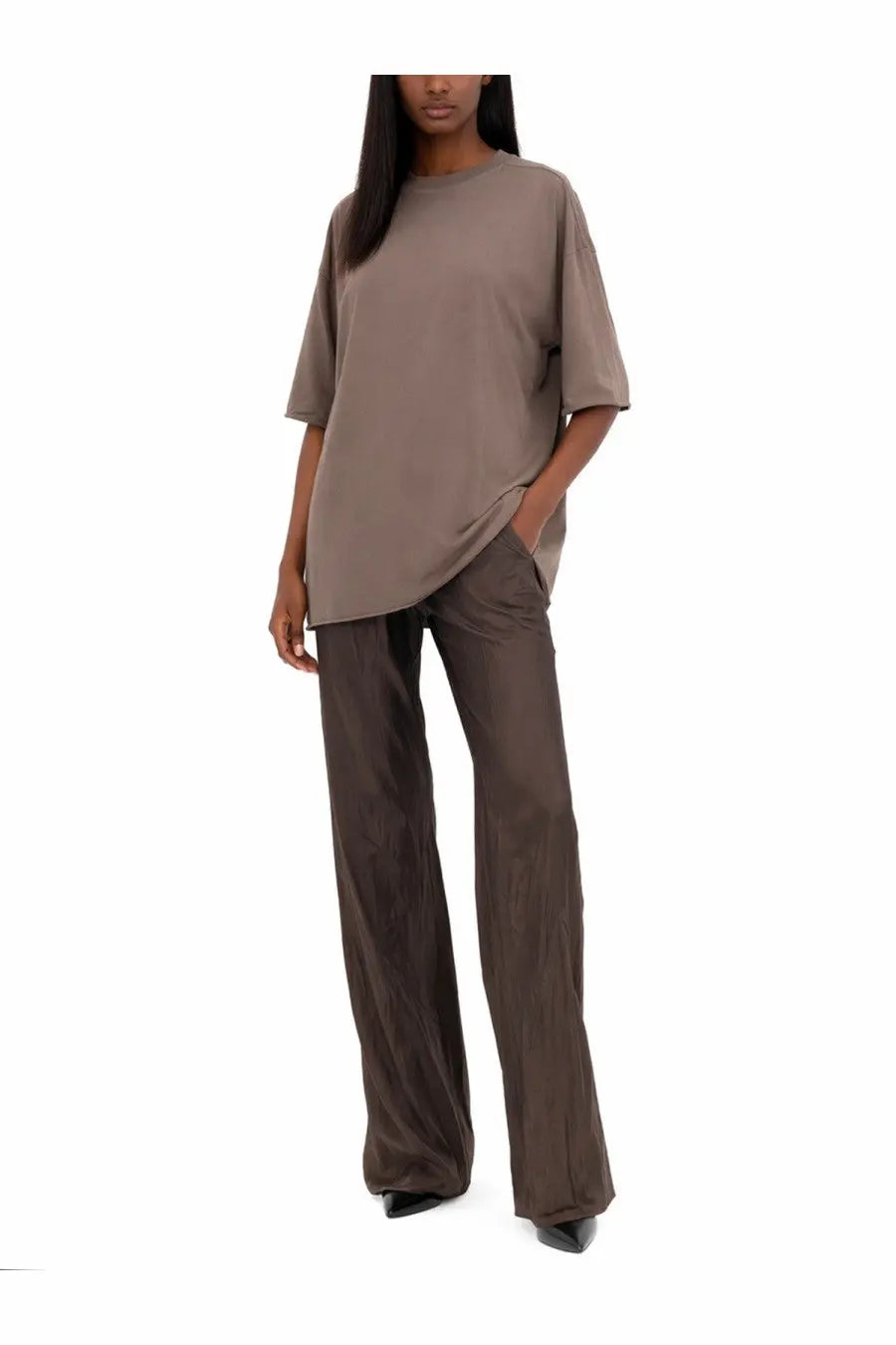 A loose-fitting taupe oversized t-shirt with short sleeves paired with rick owens women’s pants bias grey