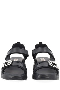Roger Vivier women’s sandalo Viv on the Run black suede-look sandals with chunky sole and white floral strap embellishments