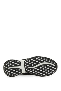 Black and white diamond-patterned sole of roger vivier women’s viv run fabric sneaker black visible from back side