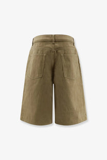 The back side of rohe women’s cotton bermuda shorts in khaki with a relaxed fit and two back pockets