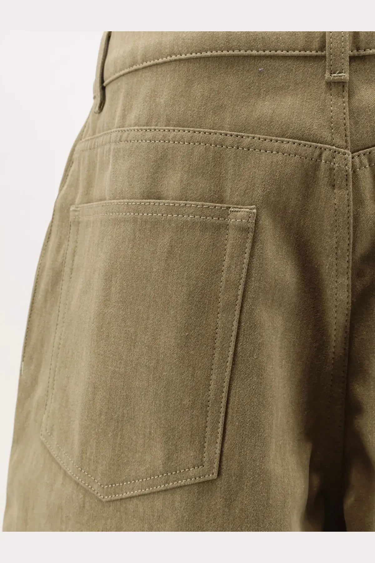 Image of the back side of rohe women’s cotton bermuda shorts in olive green with single back pocket and matching stitching