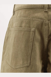 Image of the back side of rohe women’s cotton bermuda shorts in olive green with single back pocket and matching stitching