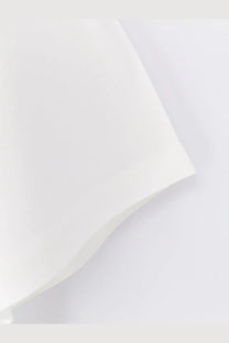 A soft off-white rohe women’s cotton blend shirt fabric with smooth texture and gentle folds