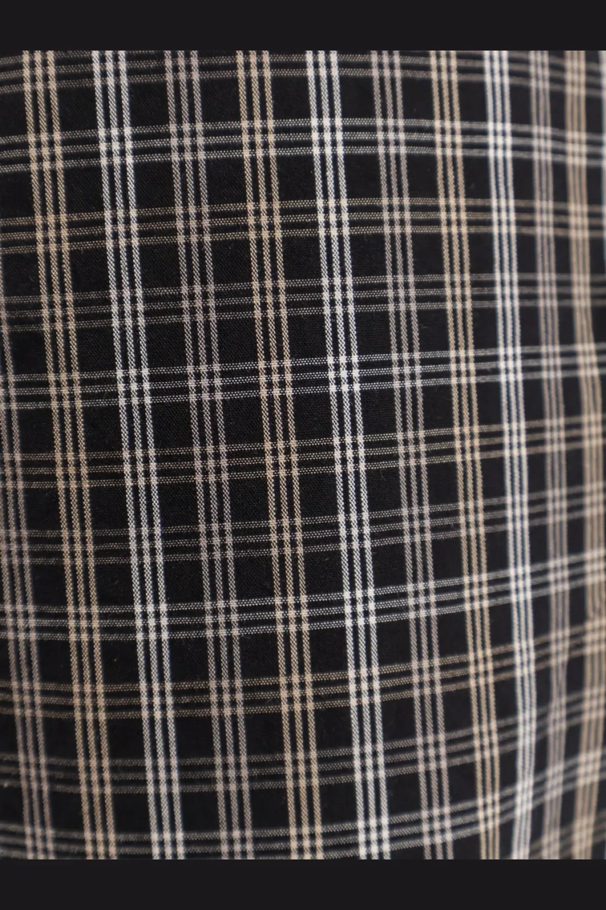 Black plaid madras cotton fabric with thin white and beige lines for rohe womens trousers black