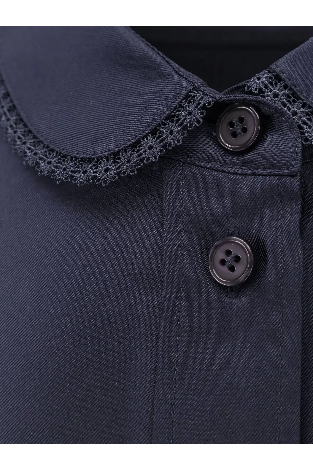 Dark navy blue silk women’s shirt with black lace trim along the collar and matching dark buttons by Rohe