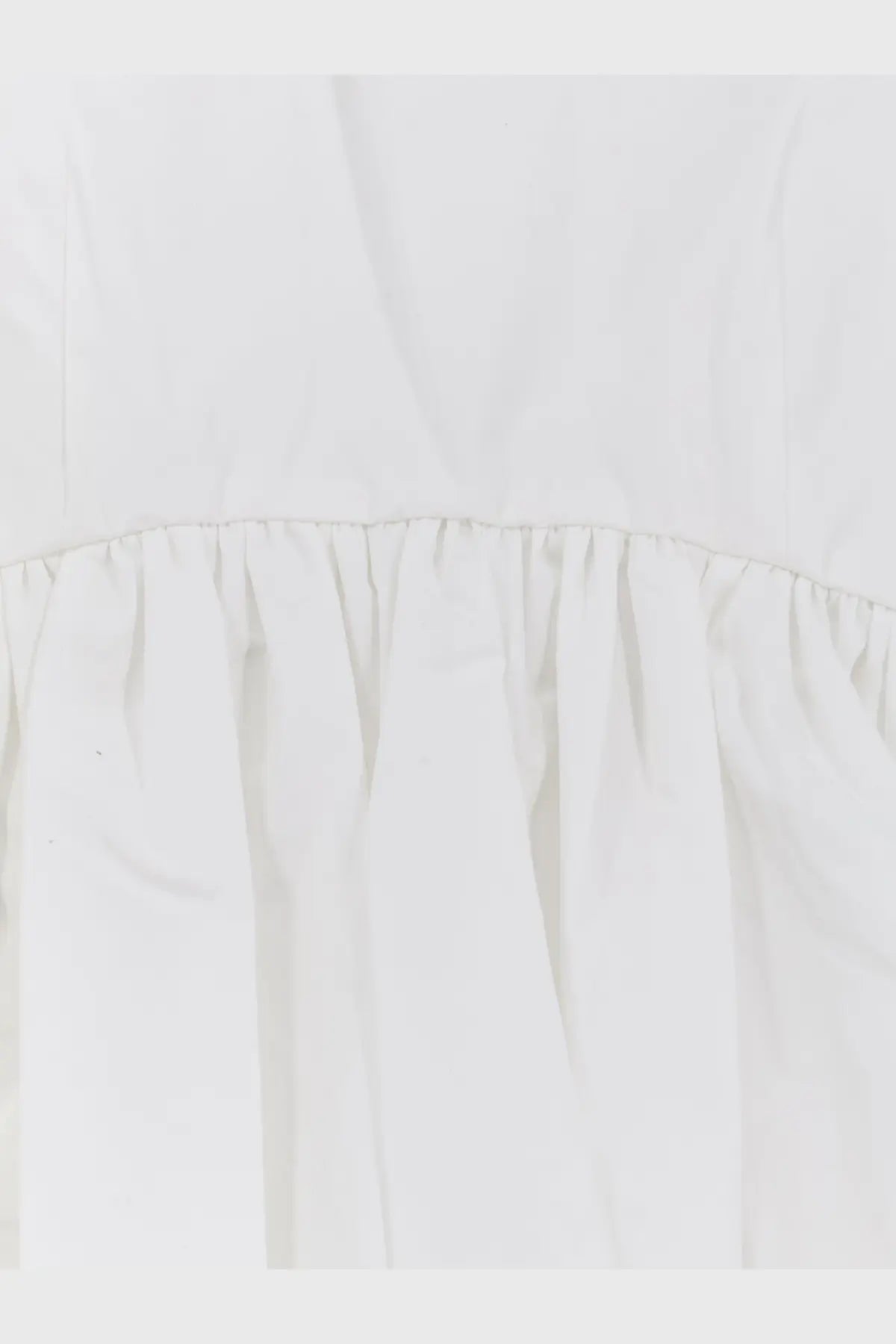 A crisp white cotton dress with a delicate ruffled hemline in rohe womens voluminous peplum cotton tank top white style