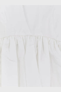 A crisp white cotton dress with a delicate ruffled hemline in rohe womens voluminous peplum cotton tank top white style