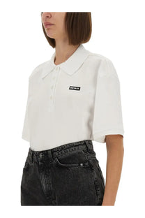 Rotate Birger Christensen women’s white cotton polo shirt with short sleeves collar button placket and black rotate logo patch