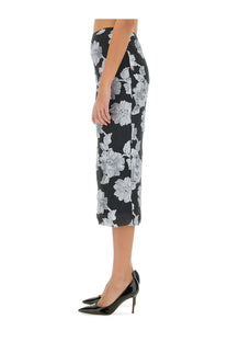 Black midi pencil skirt by Rotate Birger Christensen with bold white floral pattern on black fabric