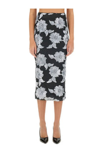 Rotate Birger Christensen women’s black midi pencil skirt with bold white floral pattern on smooth flowing fabric