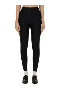 Black high-waisted nylon leggings with smooth form-fitting stretch fabric by Rotate Birger Christensen women’s collection