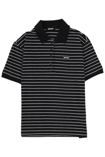 Rotate Birger Christensen women’s black and white striped polo shirt with ribbed collar and short sleeves featuring branding