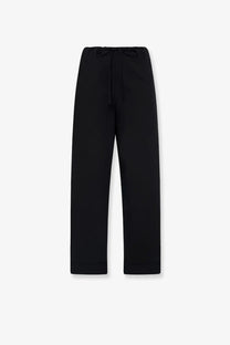 The row women’s delano cotton trousers in black feature a drawstring waist and straight legs for a comfortable fit