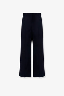 The row women’s dender wool trousers are blue wide-leg with a sleek tailored design and subtle creases
