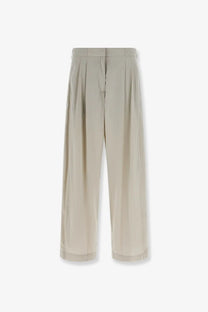 Beige pleated wide-leg trousers in smooth lightweight fabric and clean hemline from The Row women’s iven silk and nylon collection