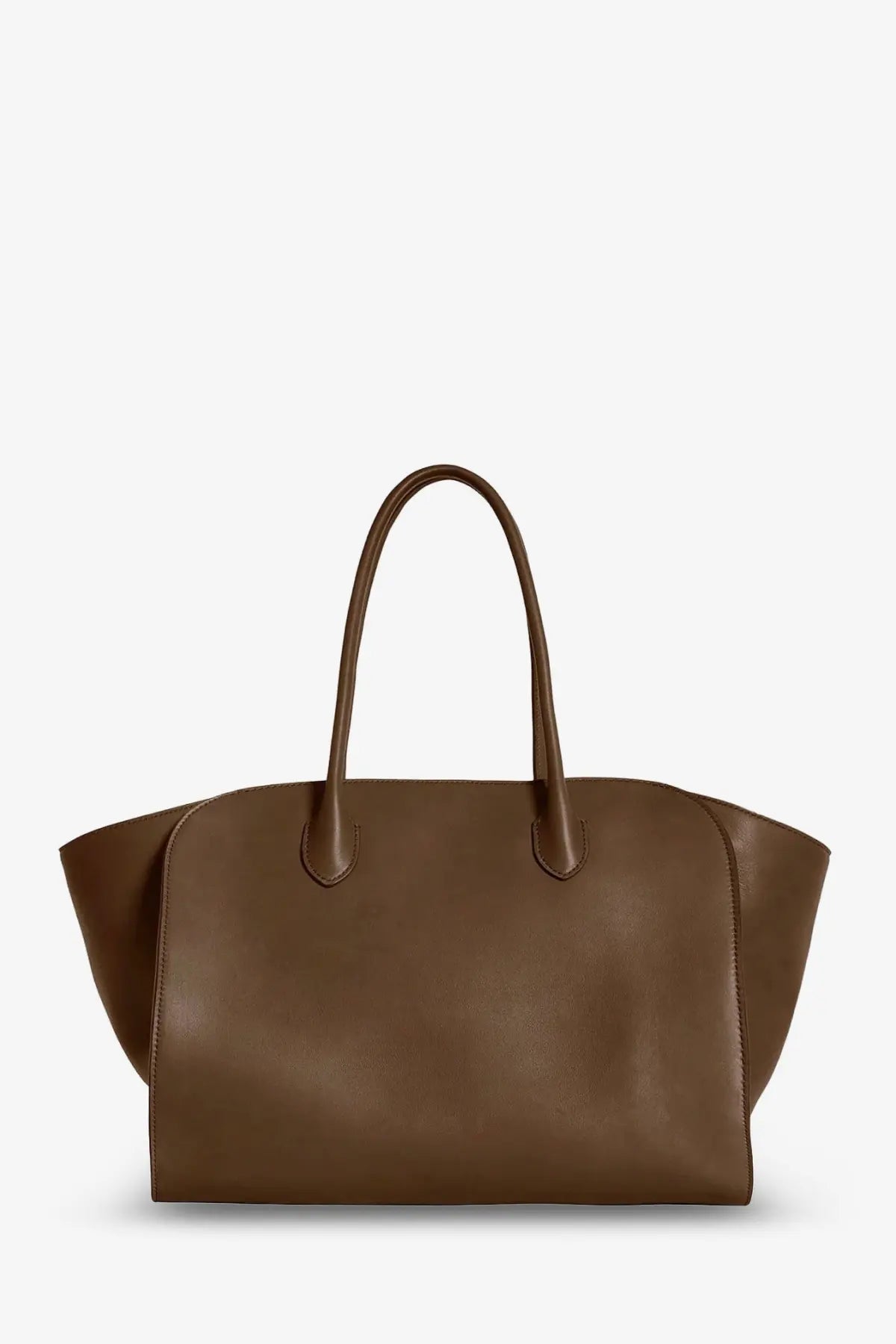 The row women’s marlo leather shoulder bag brown is a sleek medium brown leather tote with curved handles and a minimalist design