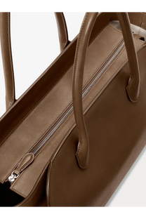 The row women’s marlo leather shoulder bag brown is a brown leather tote with silver zipper and matching handles