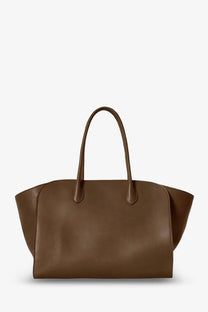 The Row women’s Marlo leather shoulder bag in brown features a structured shape with matching leather tote handles