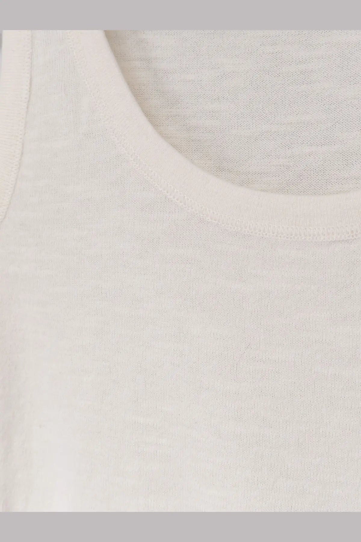 The Row women’s Nobue tank top in snow is a soft off-white cotton and linen blend with a simple round neckline