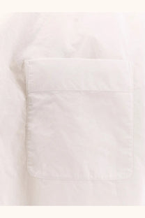 White fabric pocket with neat stitching and soft cotton texture on the row women’s victoria cotton shirt white