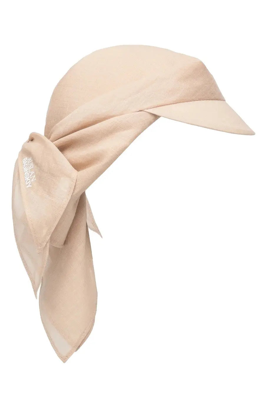 Beige silk scarf styled as headscarf with small brim and side bow in Ruslan Baginskiy women’s Sciarpa Con Visore white