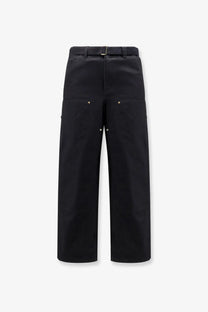 Sacai men’s Carhartt Wip black duck cotton wide-leg trousers with belt and metallic rivets on pockets