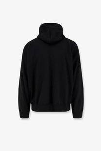 Sacai men’s black cotton sweatshirt with a relaxed fit and ribbed cuffs shown from the back side