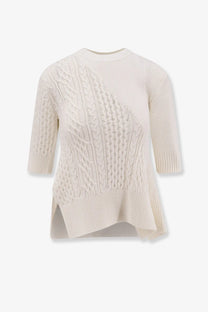 Sacai women’s white asymmetrical cotton blend sweater with cream knit and diagonal cable knit pattern three quarter sleeves