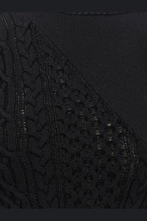 Sacai women’s black cotton blend knit sweater with intricate cable and openwork patterns and asymmetrical design