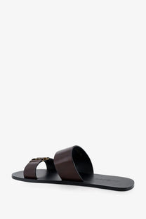 Saint Laurent men’s babylone black leather slide sandal with gold-tone buckle in brown