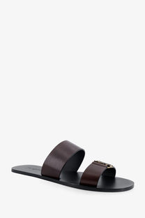 Saint Laurent men’s babylone dark brown leather slide sandal with black sole and gold-tone buckle