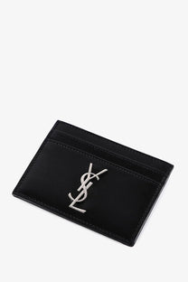 Black patent leather card holder with silver-tone ysl logo emblem by Saint Laurent men’s cassandre collection