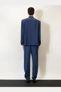 Navy blue satin suit with tailored fit and subtle sheen paired with saint laurent men’s certified viscose and silk blue shirt