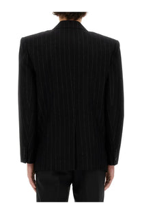 Saint Laurent men’s oversize black pinstripe blazer with subtle vertical stitching details in wool fabric