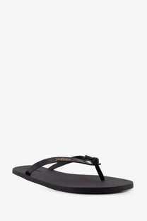 Saint Laurent men’s party low rubber sandals in black with glossy finish and gold logo on flip-flop strap