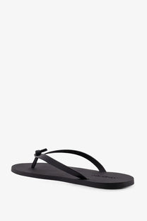 Saint Laurent men’s party low black rubber sandal with minimalist design and small knot detail on strap