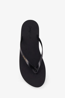 Black leather saint laurent men’s party low rubber flip-flop with gold-tone branding on strap and sole