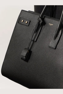 Saint Laurent men’s sac de jour large black leather shoulder bag with gold-tone hardware and textured surface
