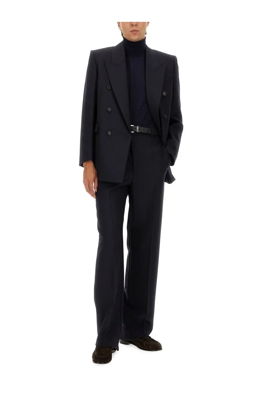 Black double-breasted suit with tailored fit and structured shoulders paired with saint laurent men’s blue turtleneck pullover