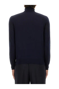 Saint Laurent men’s turtleneck pullover in navy blue with a sleek fine-knit texture and smooth finish