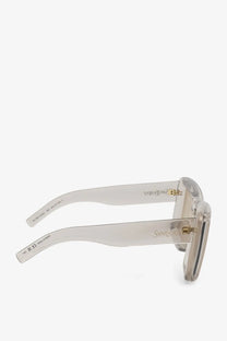 Saint Laurent women’s beige acetate sunglasses with clear rectangular frames and gold-tone hardware