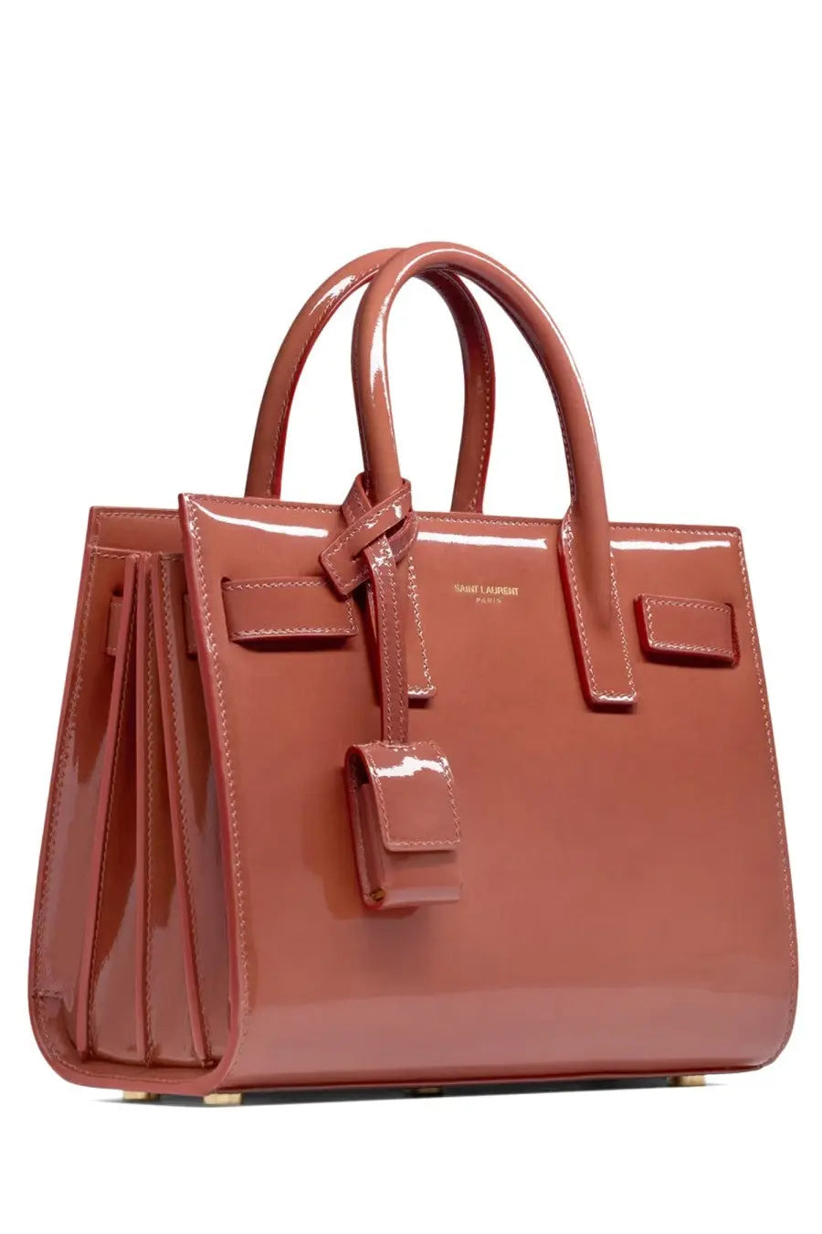 A glossy terracotta Saint Laurent women’s Sac de Jour Nano bag with structured design and top handles