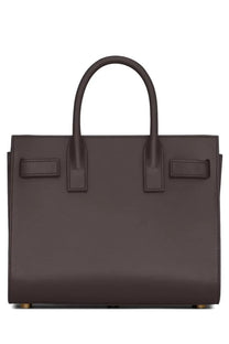 Saint Laurent women’s dark brown leather sac de jour nano bag with structured rectangular shape and top handles