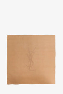 Beige Saint Laurent women’s Cassandre silk scarf with subtle YSL monogram logo in soft silk fabric