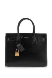 Saint Laurent women’s classic baby sac de jour bag black leather with gold-tone lock and keychain