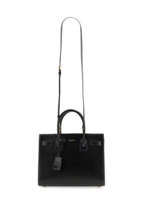 Saint Laurent women’s classic baby sac de jour bag in black leather with gold-tone hardware and detachable shoulder strap