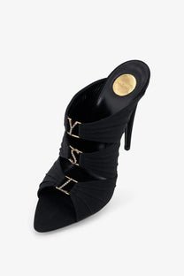 Saint Laurent women’s Emilie black satin mule heel with gold-tone LV monogram buckles and high stiletto sole
