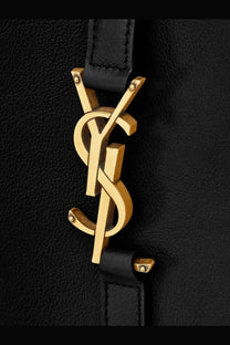 Gold-tone YSL logo plaque on black leather strap of Saint Laurent women’s Le À hammered leather shoulder bag black